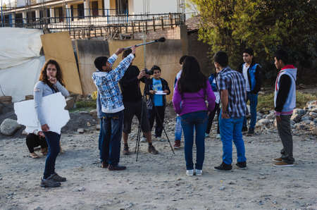 Yungay, Peru, August 5, 2014: NGO cooperators teaching short films workshop to a group of humble teenagers and recording with camera and microphoneのeditorial素材