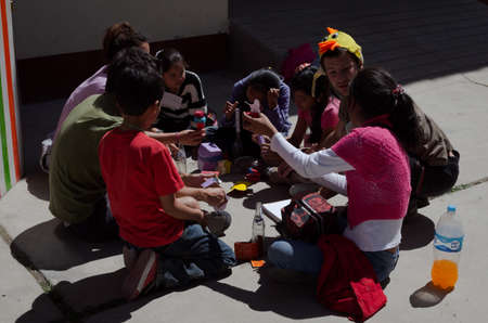 Yungay, Peru, August 4, 2014: group of Latino boys and girls with NGO workers doing a puppet workshopのeditorial素材