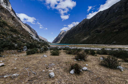 Trekking from the Santa Cruz gorge with the lagoon in the background between mountains, Peruの写真素材