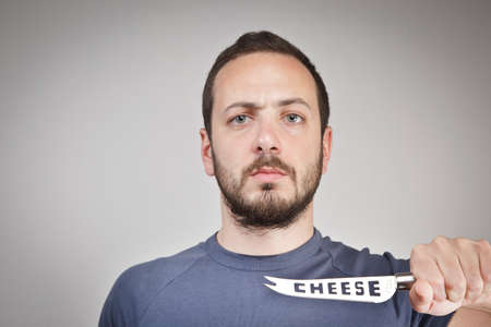 A man with cheese knifeの写真素材