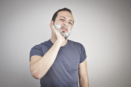 Young man shavingの写真素材