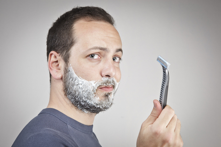 Young man shavingの写真素材