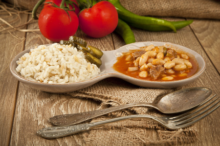 Hot turkish bean stew with a tasty tomato sauce and rice turkish pilavの写真素材