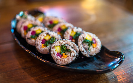 Closeup view of Korean food kimbap on wooden tableの写真素材