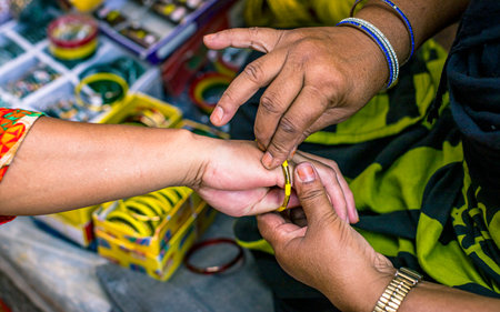 Close up of Thai man and woman hands with wedding rings in the market.の写真素材