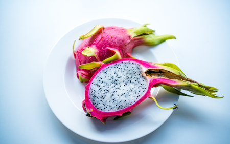 Dragon fruit on white plate. Close up of dragon fruit on white background.の写真素材