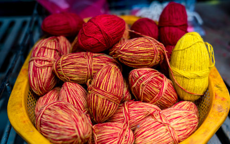 Colorful wool yarn balls for sale at a market in India.の写真素材