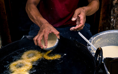 Thai pancake making in the street of Kathmandu, Nepalの写真素材