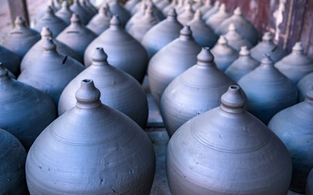 Clay pots in the pottery workshop, closeup of photo