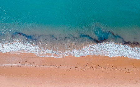 Aerial view of beautiful sandy beach with turquoise sea water in South korea