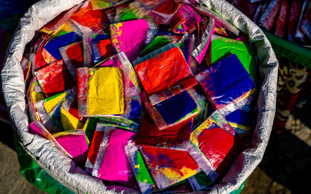 Colorful paper bags for sale in a street marketの写真素材