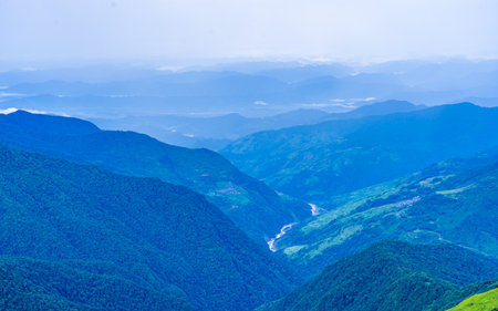 Mountain landscape with a view of the valley and the river.