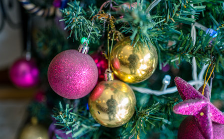 Decorated christmas tree with colorful ornaments, close upの写真素材
