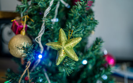 Christmas tree decoration with ornaments, lights and bokeh
