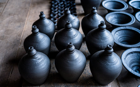 Clay pots on a wooden table. Selective focus. Toned.の写真素材