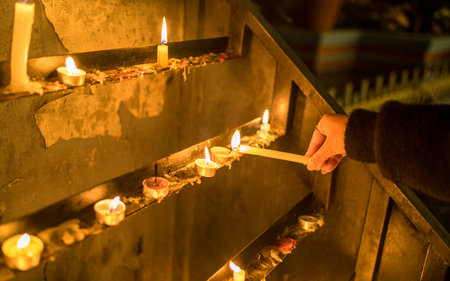 Burning candles in a Buddhist temple. Selective focus. Toned.の写真素材