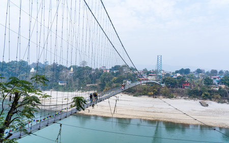 Suspension bridge over the narayani river in Nepal.の写真素材