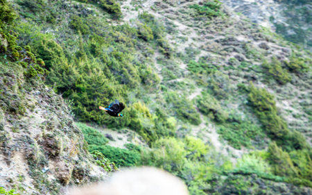 Climbing on a cliff in the mountains. Extreme sport.