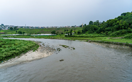 Panorama view of rice fields and river in countryside of Thailand.