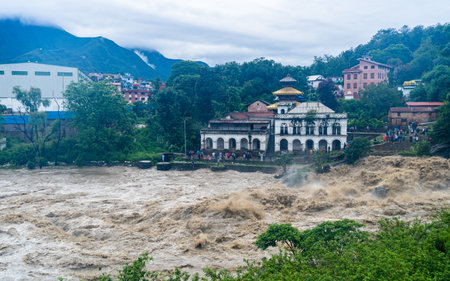 The Bagmati River flooded and affected the riverbanks and homes during heavy rainfall in Kathmandu, Nepalの写真素材