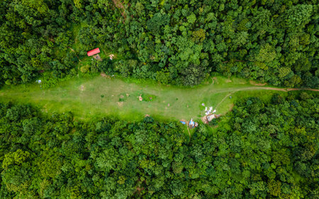 A drone captures the lush greenery of Champadevi Hill after rainfall in Kathmandu, Nepal.の写真素材