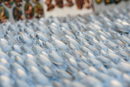 Spoons on the market under the open skyの写真素材