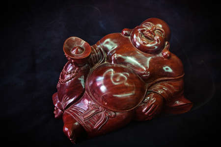 Budai the Chinese deity from mahogany Tomoyasu Hoteiの写真素材