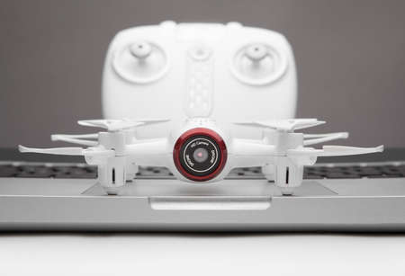 small quadrocopter drone mini white text keywords notebooks rc backgrounds desktop wallpaper cmd commando space clip paste view top trend hd 4k video footage montageの写真素材