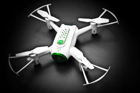 small quadrocopter drone mini white text keywords notebooks rc backgrounds desktop wallpaper cmd commando space clip paste view top trend hd 4k video footage montageの写真素材