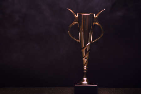 Gold Cup Smoke Texture Dark Background studioの写真素材