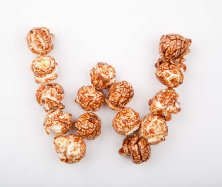 Caramel Pop Corn Alphabet white backgroundの写真素材