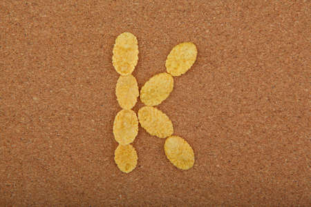 Corn Flakes Alphabet wooden backgroundの写真素材