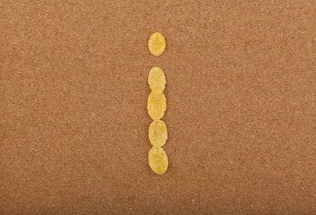 Corn Flakes Alphabet wooden background