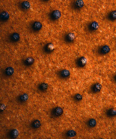 Black pepper wooden backgroundの写真素材