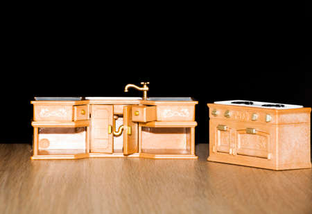 Baby plastic toy kitchen dark backgroundの写真素材