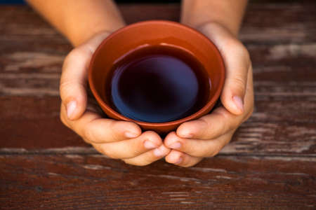 Black Chinese tea cup handsの写真素材