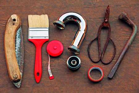 home tools wooden table iron pipe question symbol