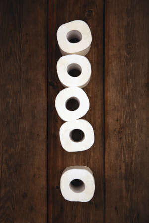 Toilet paper exclamation mark symbol wooden tableの写真素材