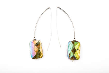 silver earrings labradorite stone white backgroundの写真素材