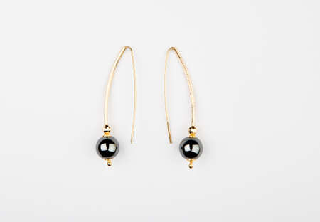 onyx stone gold earrings white background nobodyの写真素材