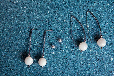 silver earrings moonstone marble background nobody