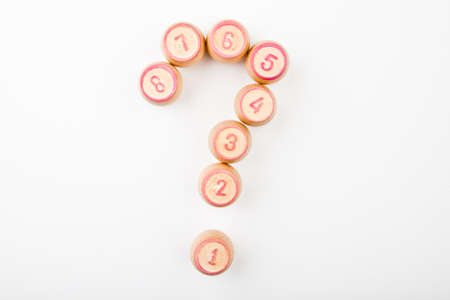 wooden lotto game question mark white backgroundの写真素材