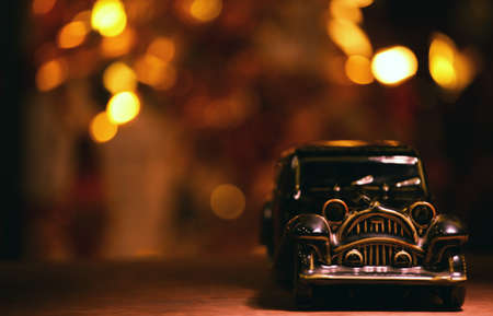 retro toy car gold bokehの写真素材