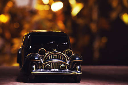 retro toy car gold bokehの写真素材