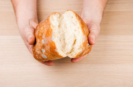 hands bad bread table