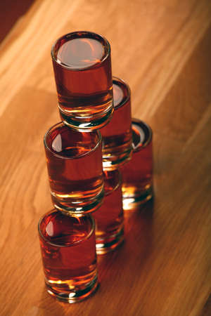 cognac shot pyramid smoke wooden table