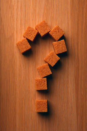 cane sugar question mark wooden tableの写真素材