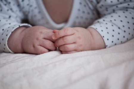 baby girl hands bedroom morning