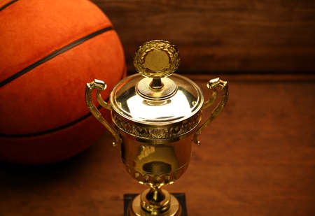 basketball ball cup wooden desk backgroundの写真素材