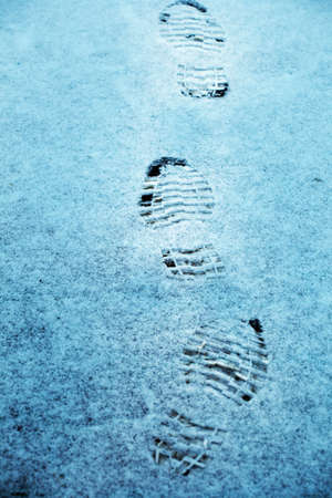 winter traces boots snowの写真素材